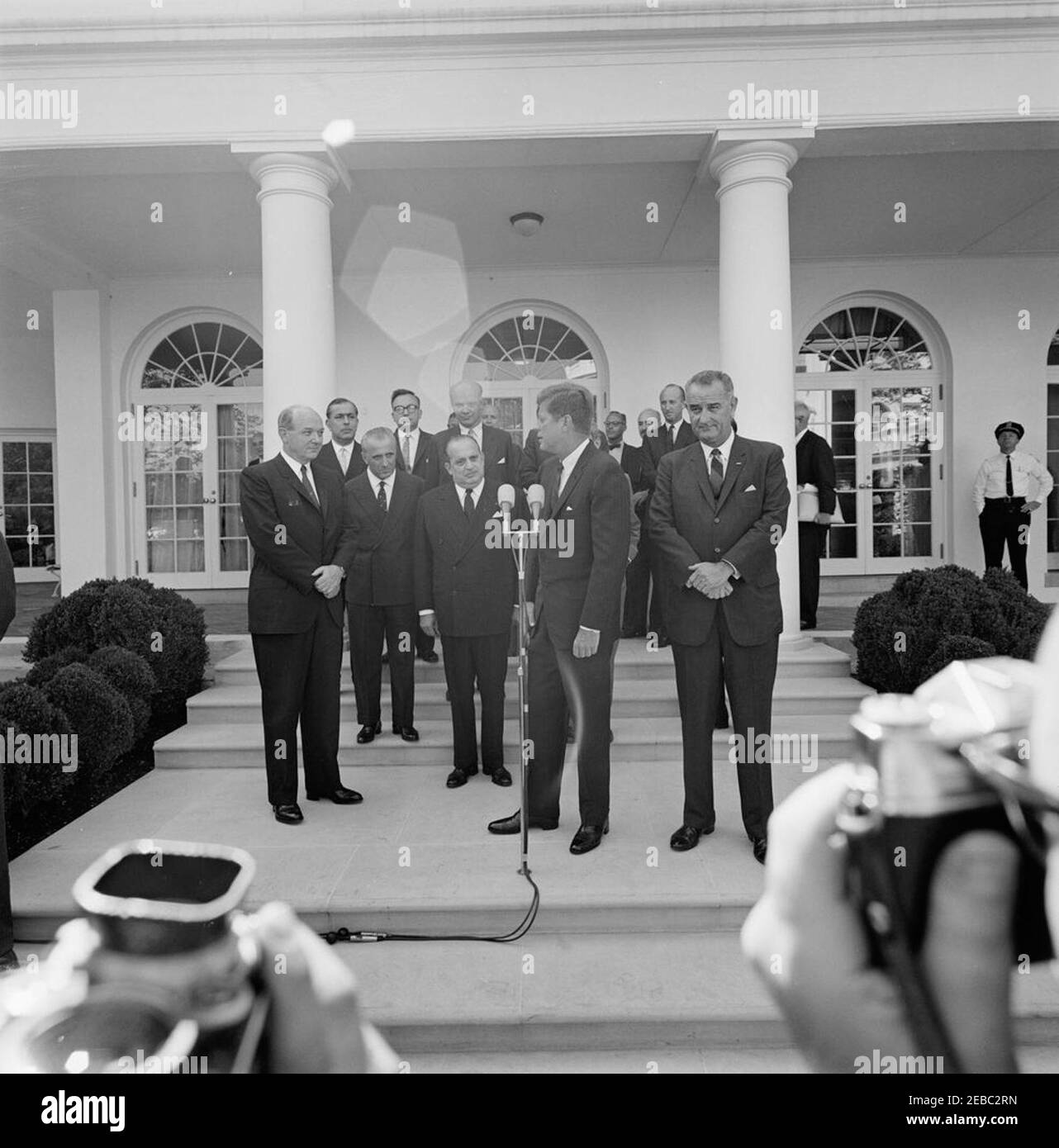 Ceremony marking Vice President Lyndon B. Johnsonu0027s (LBJ) departure on a good-will trip, 3:30PM. President John F. Kennedy delivers remarks during a ceremony marking Vice President Lyndon B. Johnsonu2019s departure for a good-will trip to Lebanon, Iran, Turkey, Greece, Cyprus, and Italy; Vice President Johnson stands at right. Also pictured: Secretary of State, Dean Rusk; Ambassador of Lebanon, Ibrahim Hussein el-Ahdab (al-Ahdab); Ambassador of Italy, Sergio Fenoaltea; Ambassador of Nicaragua and Dean of the Diplomatic Corps, Dr. Guillermo Sevilla-Sacasa; Deputy Assistant Secretary of St Stock Photo