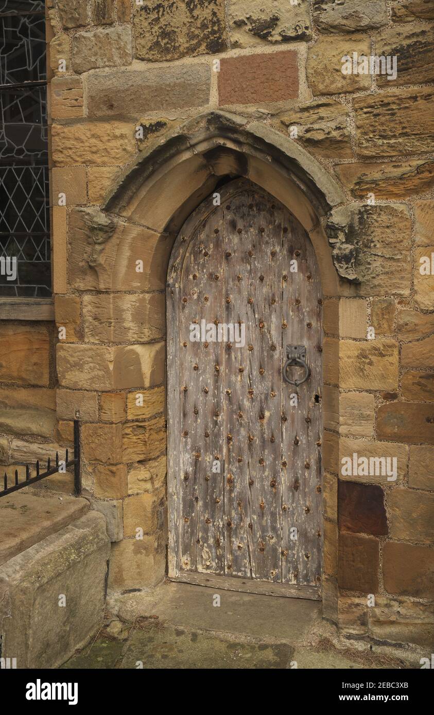 Ancient wooden door to St Mary's Church, Whitby, North Yorkshire, England, UK Stock Photo