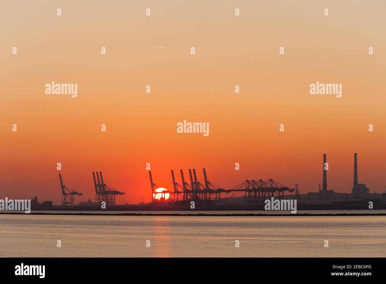Sunset view of industrial port of Le Havre from Honfleur Stock Photo