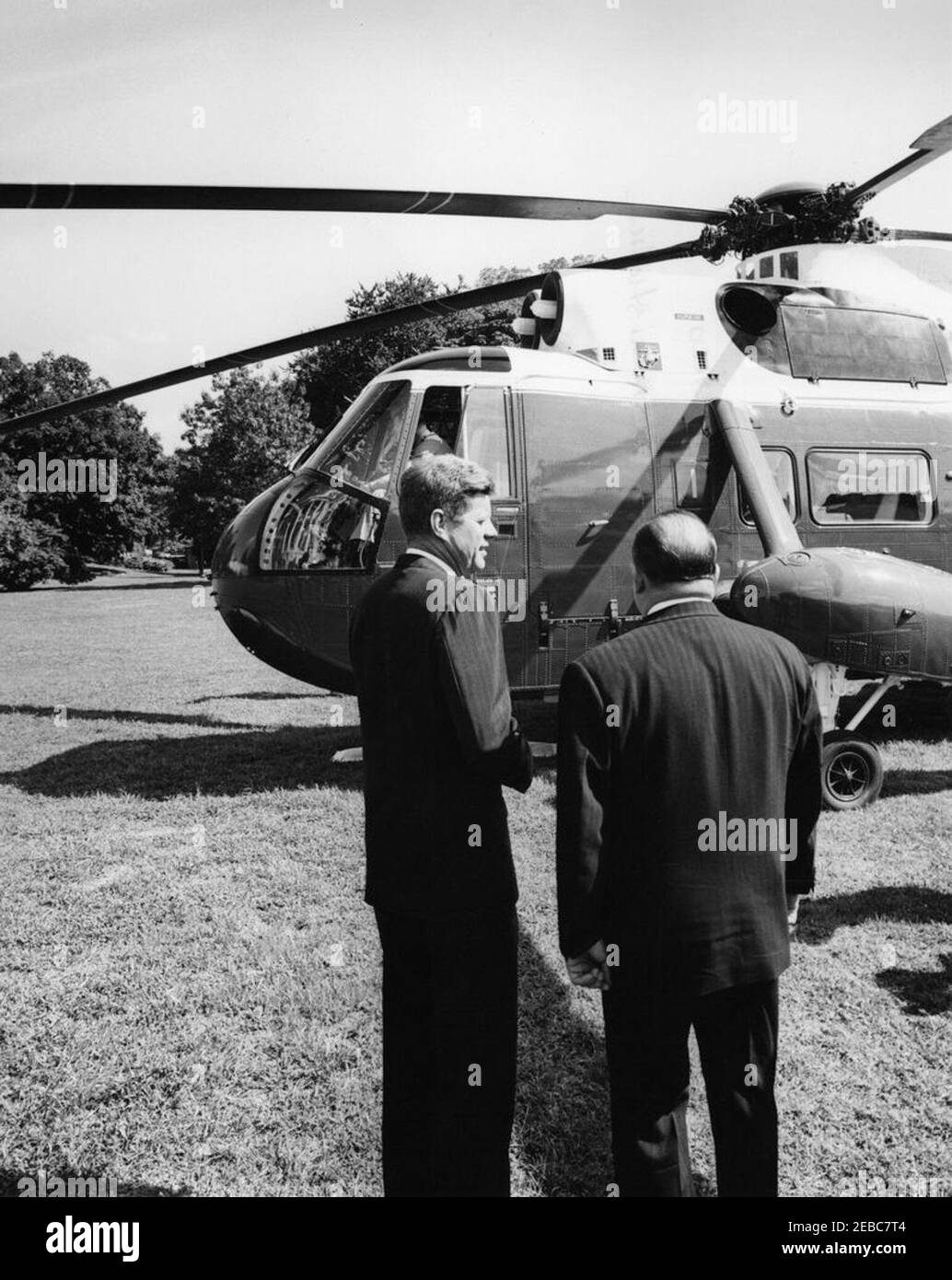 Ceremony marking Vice President Lyndon B. Johnsonu0027s (LBJ) departure on a good-will trip, 3:30PM. President John F. Kennedy stands with Ambassador of Nicaragua and Dean of the Diplomatic Corps, Dr. Guillermo Sevilla-Sacasa, on the South Lawn as Vice President Lyndon B. Johnsonu2019s helicopter prepares to depart for his good-will trip to Lebanon, Iran, Turkey, Greece, Cyprus, and Italy. White House, Washington, D.C. Stock Photo