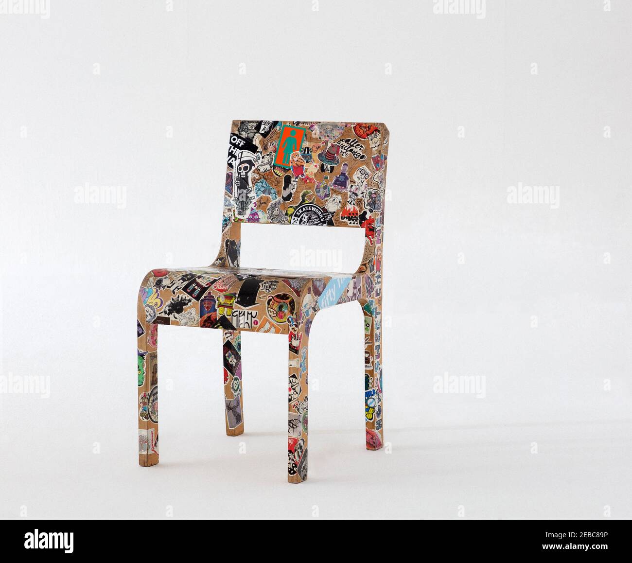 chair covered in stickers with white background Stock Photo - Alamy