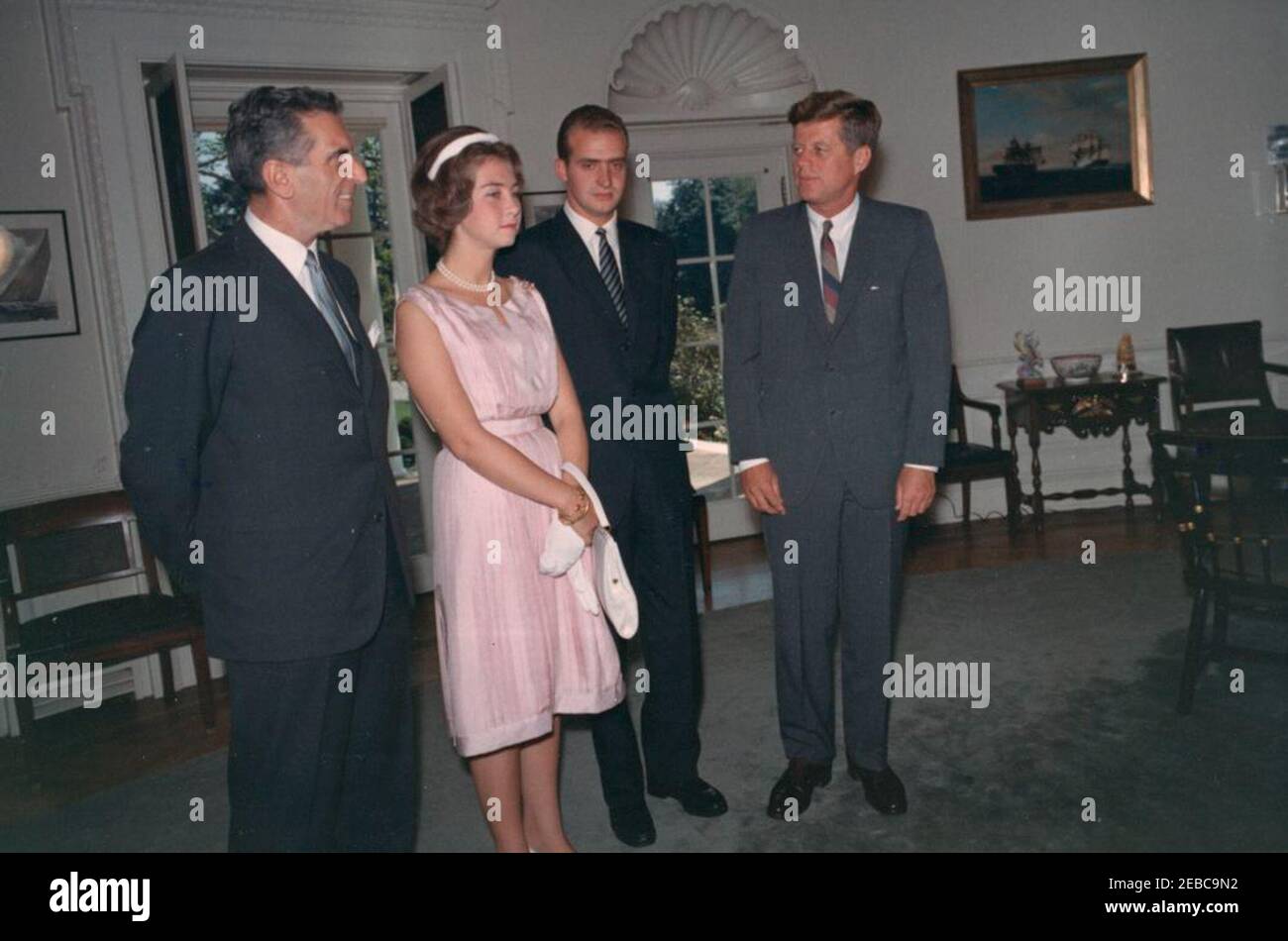 Meeting with Prince Juan Carlos of Spain, 12:06PM. President John F. Kennedy meets with Prince Juan Carlos of Spain (second from right) and his wife, Princess Sophia of Greece; Ambassador of Spain, Antonio Garrigues y Du00edaz-Cau00f1abate, stands at left. Oval Office, White House, Washington, D.C. Stock Photo