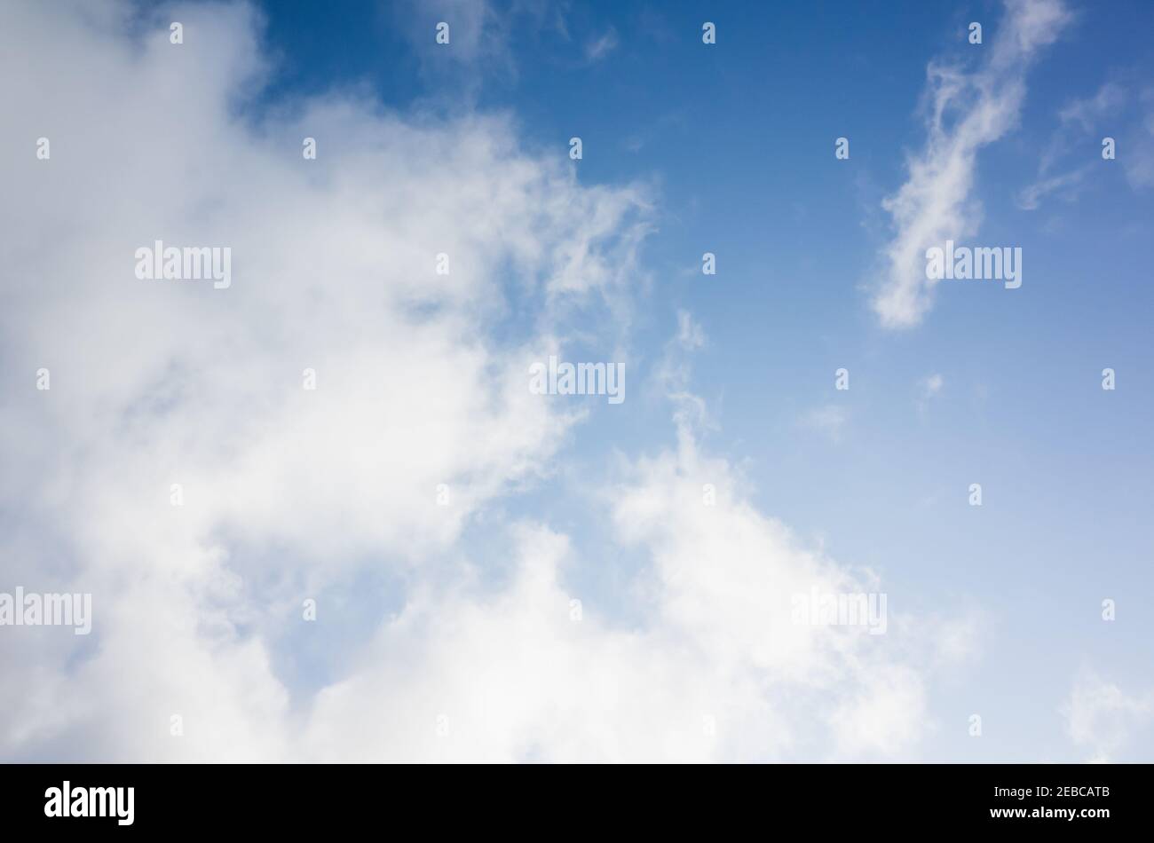 Blue sky with white cumulus clouds at daytime. Natural background photo ...