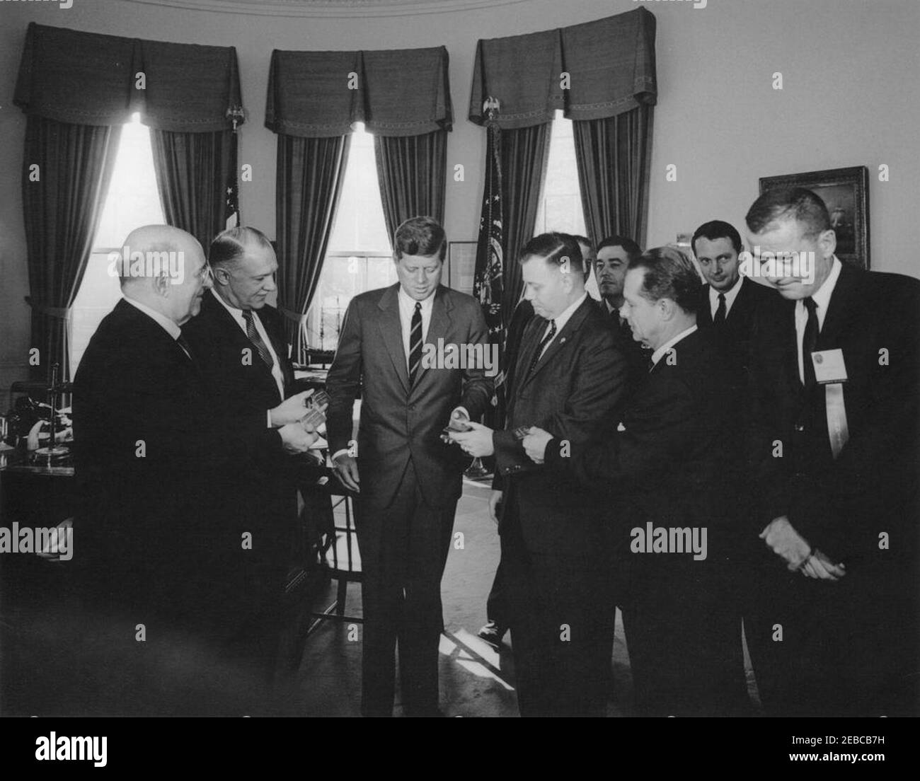 Presentation of honorary life memberships in the armed services associations, 10:00AM. President John F. Kennedy receives honorary life memberships in four armed services organizations; representatives from each organization presented President Kennedy with gold membership cards. Left to right (in foreground): President of the Association of the United States Army, Lieutenant General Milton G. Baker; National Vice President of the Navy League, Harold E. Wirth; President Kennedy; President of the Marine Corps League, Raymond B. Butts; President of the Air Force Association, Major General John B Stock Photo