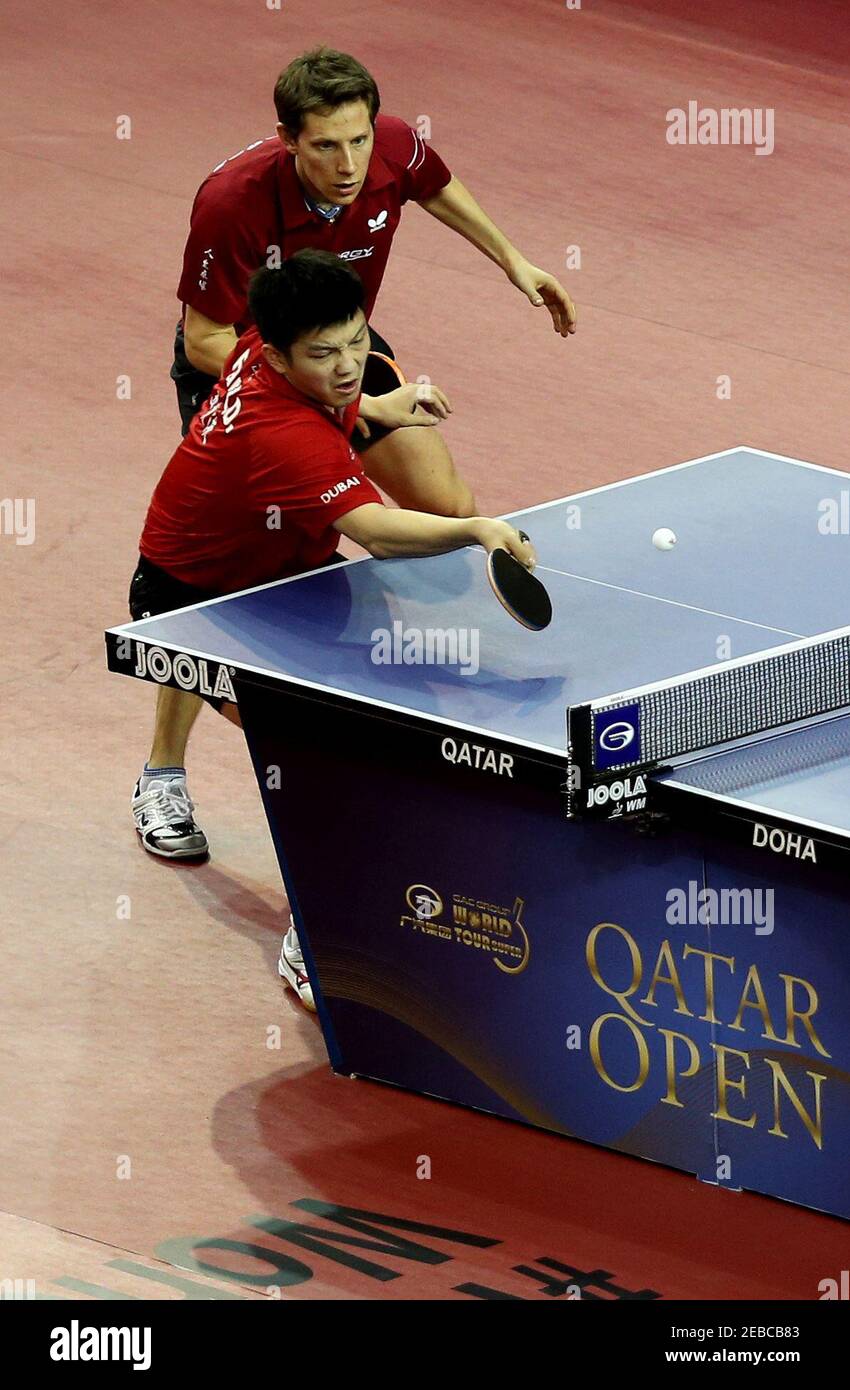 Table Tennis - ITTF - Qatar Open - Qatar - 22/2/14 Men's Doubles - Zhendong  Fan of China and Robert Gardos of Austria compete against Tristan Flore and  Emmanuel Lebesson of France