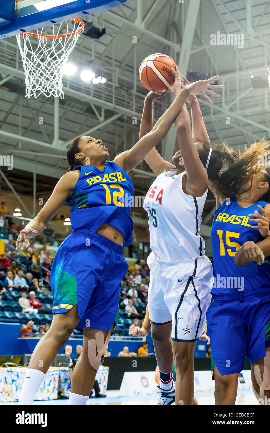 Toronto 2015 Pan Am or Pan American Games, women basketball: Brazil's Karina Jacob (12) and Kelly Santos (15) try to avoid Alaina Coates from the Unit Stock Photo