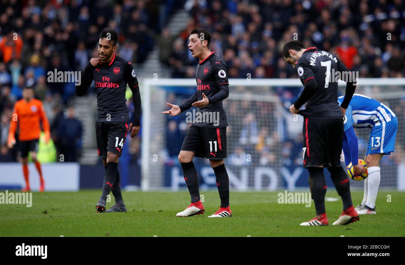 Soccer Football - Premier League - Brighton & Hove Albion vs Arsenal - The American Express Community Stadium, Brighton, Britain - March 4, 2018   Arsenal's Mesut Ozil, Pierre-Emerick Aubameyang and Henrikh Mkhitaryan look dejected after Brighton's second goal scored by Glenn Murray   REUTERS/Eddie Keogh    EDITORIAL USE ONLY. No use with unauthorized audio, video, data, fixture lists, club/league logos or 'live' services. Online in-match use limited to 75 images, no video emulation. No use in betting, games or single club/league/player publications.  Please contact your account representative Stock Photo