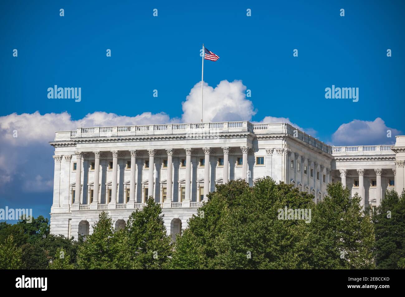 American flag flying over the exterior of the Senate chamber of the US Capitol building in Washington, DC Stock Photo