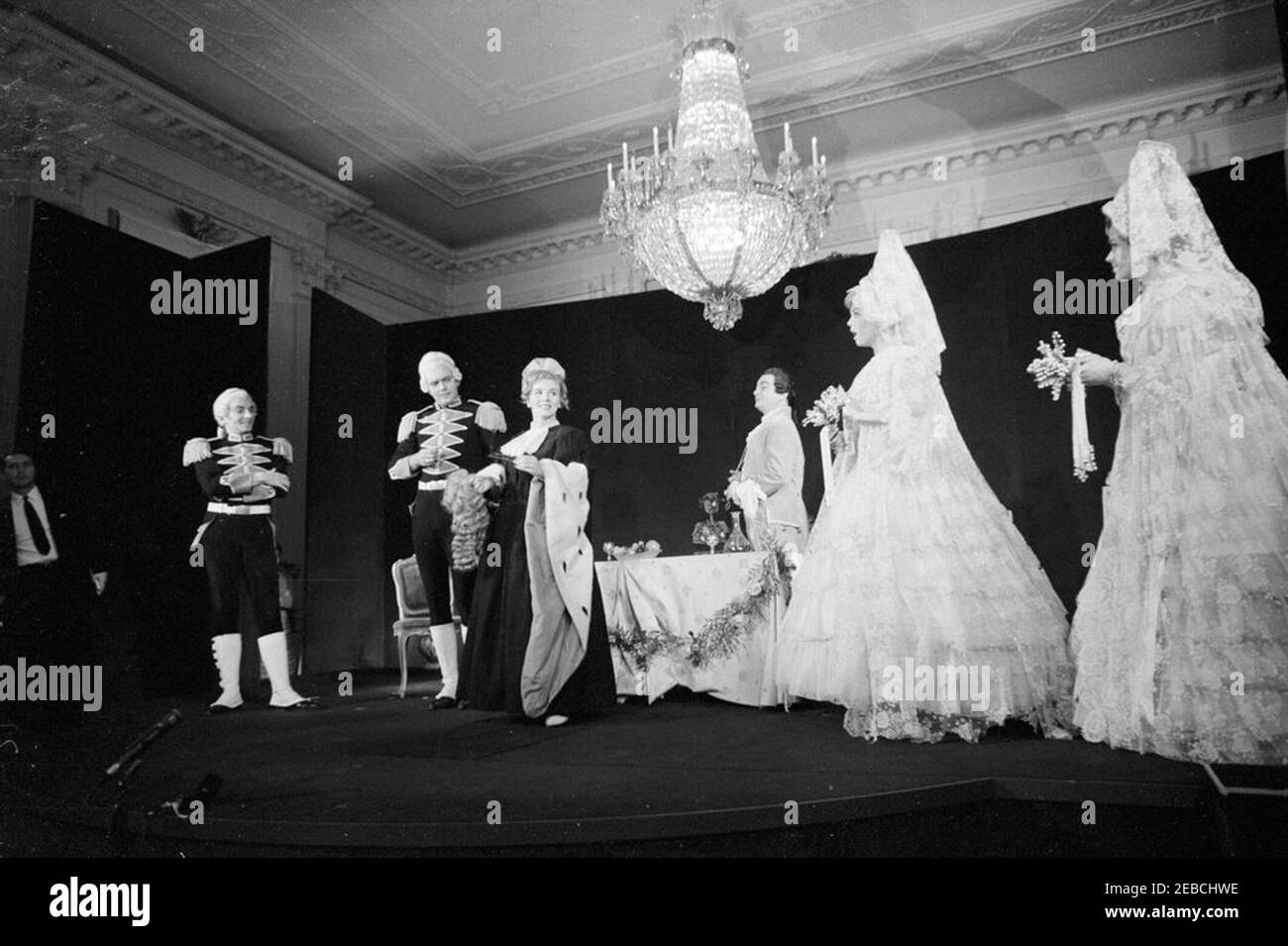 First Lady Jacqueline Kennedyu0027s (JBK) Second Musical Program for Youth: Metropolitan Opera performs selections from Mozartu2019s Cosu00ec Fan Tutte. Actors from the Metropolitan Opera Studio perform onstage during a production of Mozartu2019s u201cCosu00ec fan tutteu201d in the East Room of the White House, Washington, D.C. Left to right: Stanley Kolk, Nolan Van Way, Barbara Meister, Gimi Beni, Dorothy Coulter, and Helen Vanni. First Lady Jacqueline Kennedy held the event for children of ambassadors living in Washington, D.C.; it was the second of her Musical Programs for Youth. Stock Photo