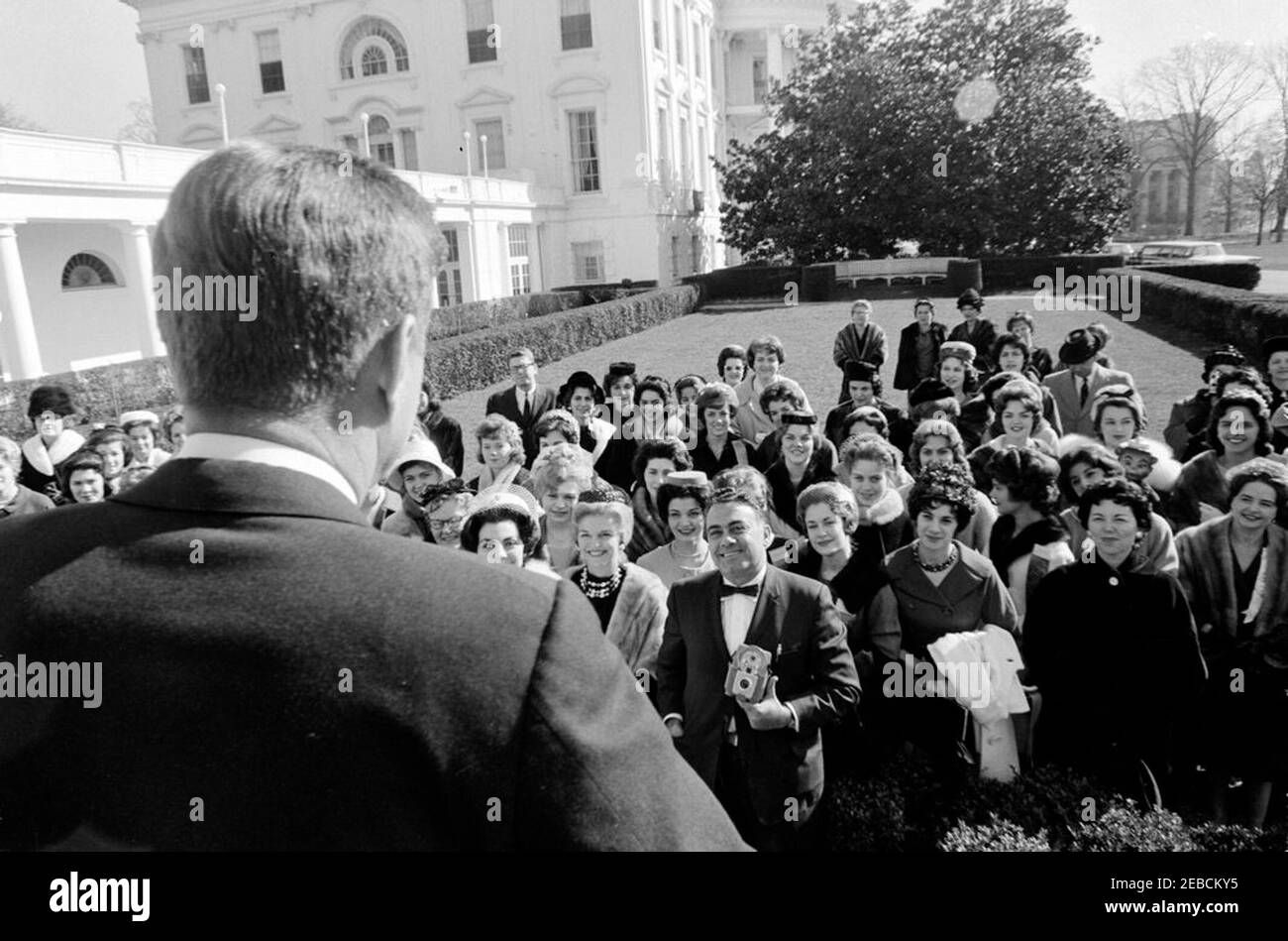 Visit of the 1962 Mardi Gras King u0026 Queen, Voris King and Rebekah Jo Hannie, 10:05AM. President John F. Kennedy addresses members of the 1962 Mardi Gras Royal Court and guests in the Rose Garden, White House, Washington, D.C. [Photograph by Dan Lewis] Stock Photo