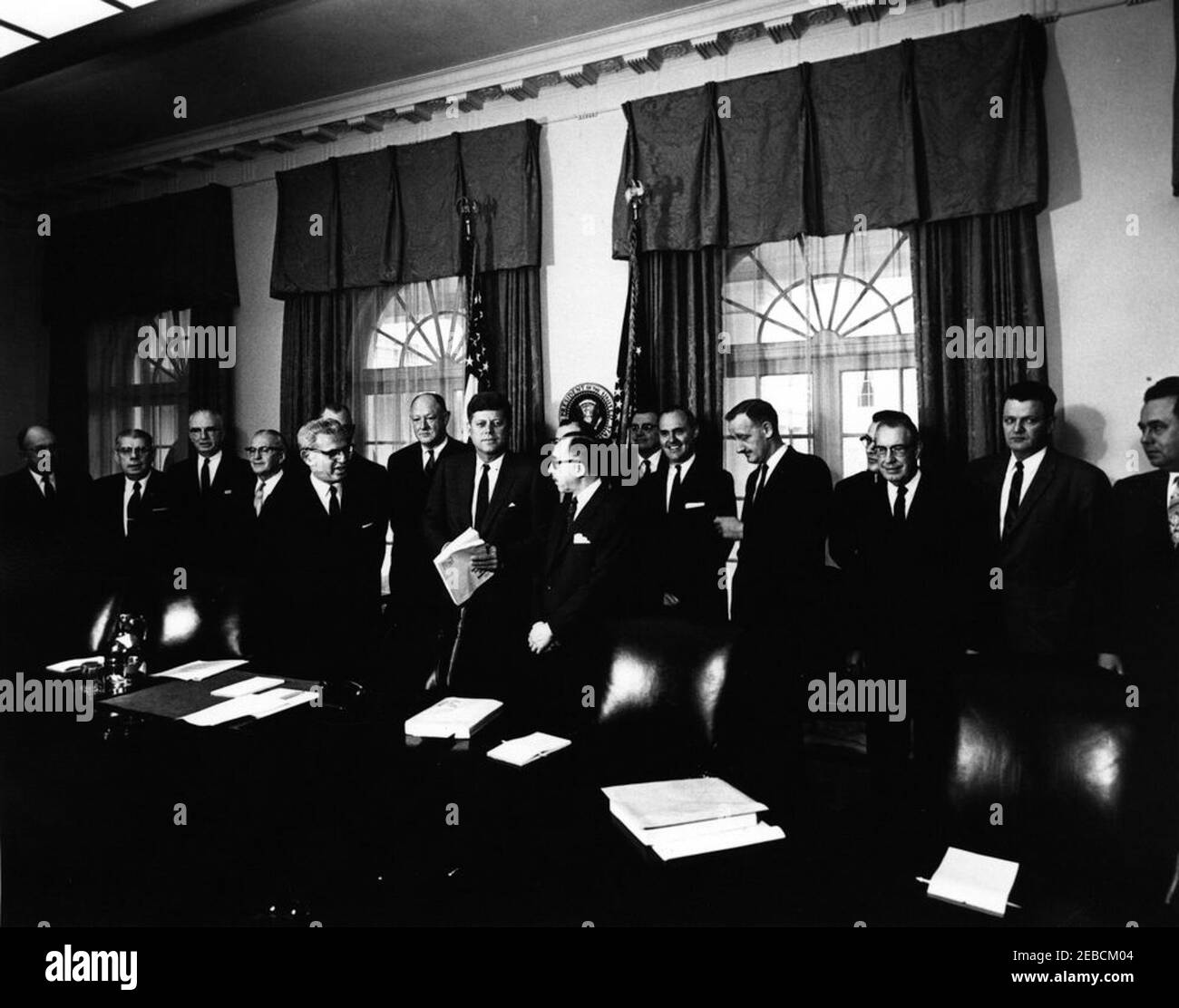 Meeting with Presidential Railroad Commission members, 10:40AM. President John F. Kennedy meets with the Presidential Railroad Commission members in the Cabinet Room, White House, Washington, D.C. Those present include: Vice Chairman of the Commission Dr. Russell A. Smith; Dr. John T. Dunlop; Dr. Charles A. Myers; Francis J. Robertson; B.B. Bryant; T. A. Jerrow; Guy W. Knight; James E. Wolfe; James W. Fallon; S.W. Holliday; S.C. Phillips; H.F. Sites; A.F. Zimmerman; Chairman of the Commission Judge Simon H. Rifkind; Executive Director Philip Arnow; Secretary of Labor Arthur J. Goldberg. Stock Photo