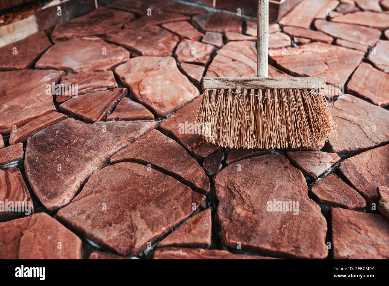 Bonding granite tiles to concrete subfloors outside the house porch
