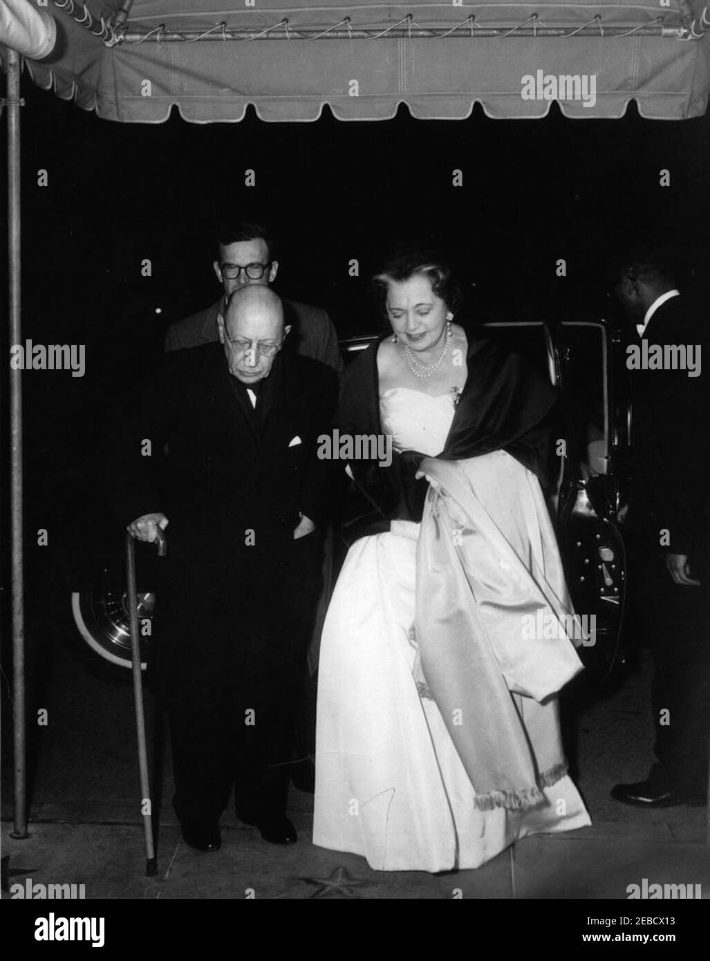 Dinner in honor of Igor Stravinsky, 8:00PM. Composer Igor Stravinsky and his wife Vera de Bosset Stravinsky arrive for a dinner party at the White House, Washington, D.C. Stock Photo
