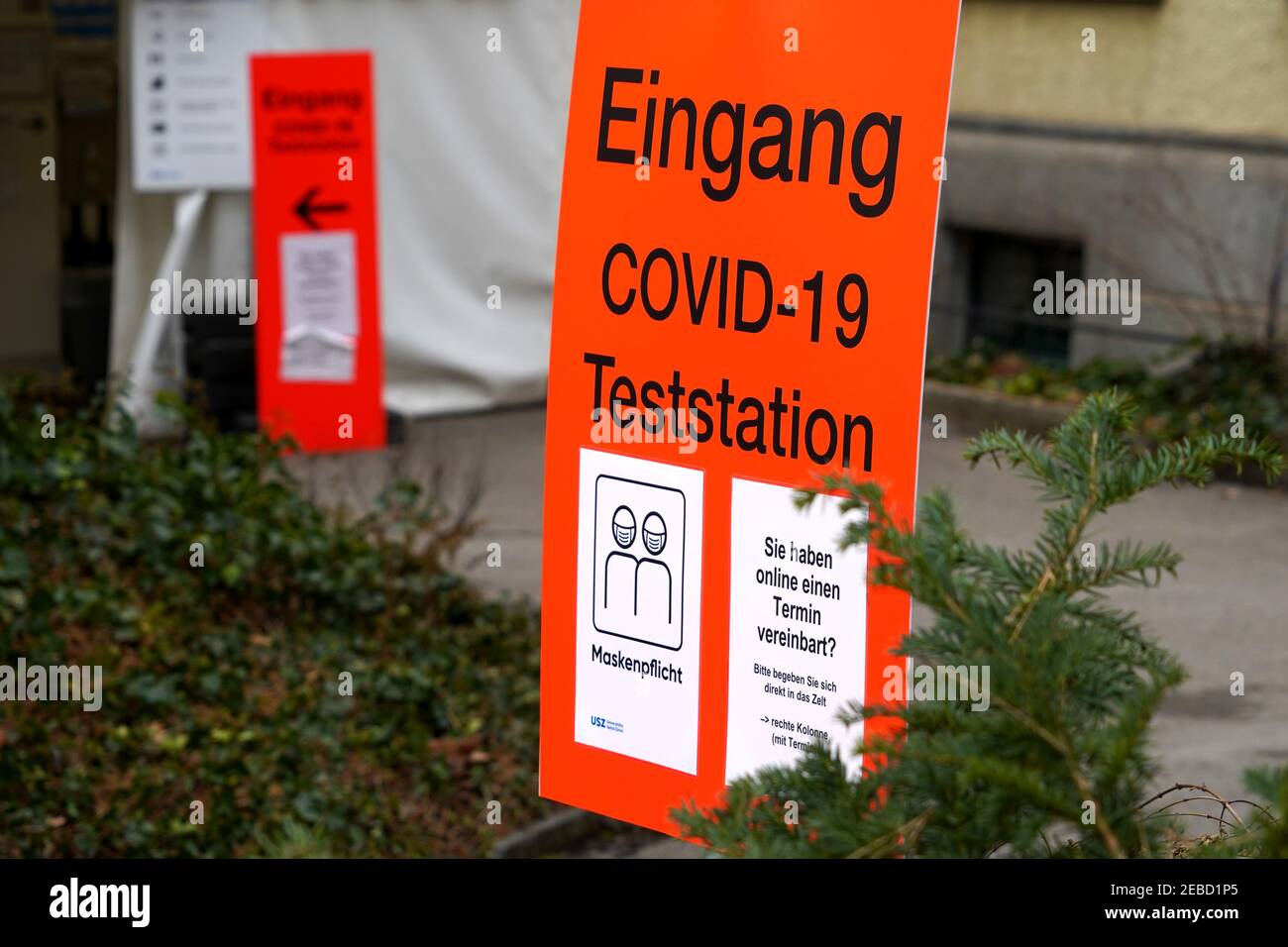 Entrance to covid-19 test point or test center on the grounds of University Hospital Zurich. Instructions concerning appointment are written in German Stock Photo