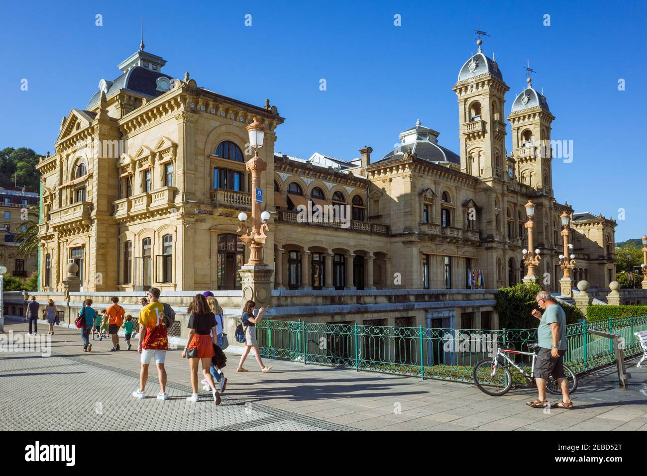 San Sebastian, Gipuzkoa, Basque Country, Spain - July 15th, 2019 : People walk past the San Sebastian city hall originally built in 1887 to house the Stock Photo