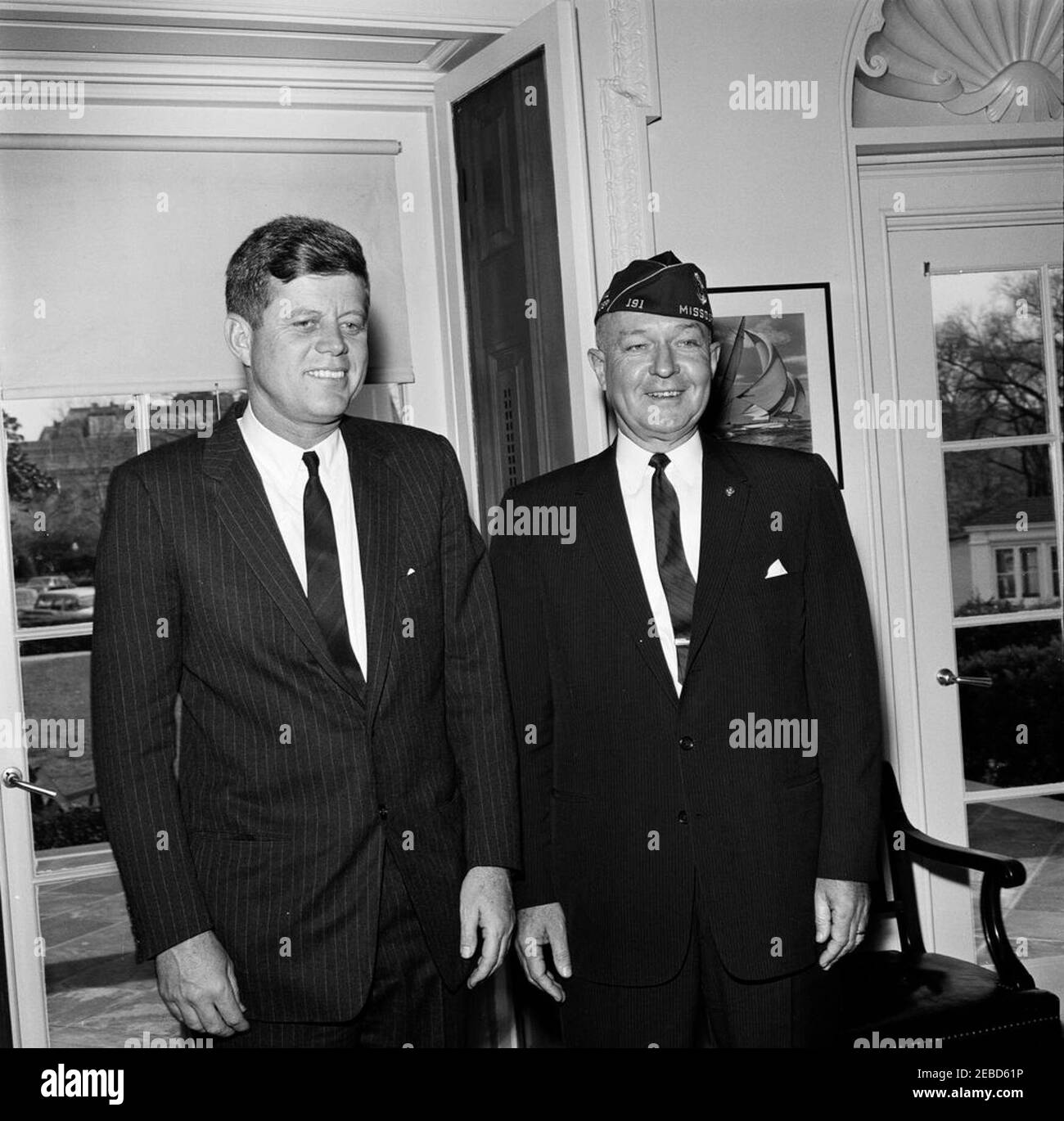 Visit of Charles L. Bacon, National Commander of the American Legion. President John F. Kennedy meets with National Commander of the American Legion, Charles L. Bacon. Oval Office, White House, Washington, D.C. Stock Photo