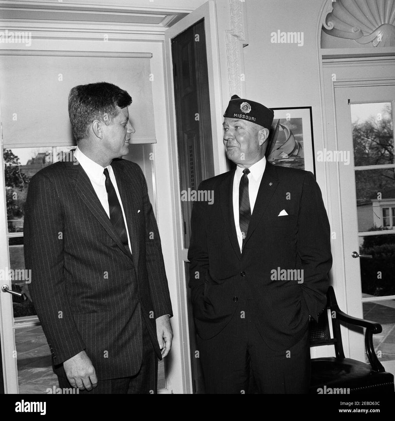 Visit of Charles L. Bacon, National Commander of the American Legion. President John F. Kennedy meets with National Commander of the American Legion, Charles L. Bacon. Oval Office, White House, Washington, D.C. Stock Photo
