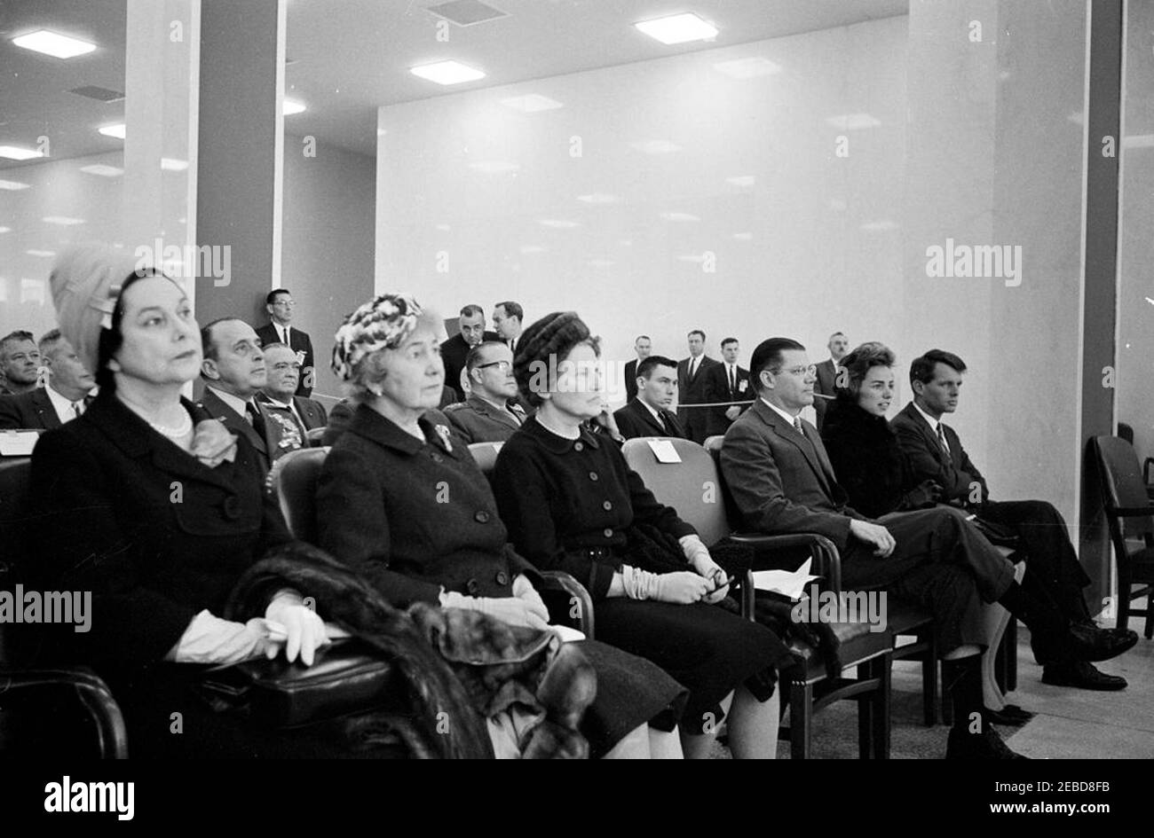 Presentation of the National Security Medal to Allen Dulles, 11:00AM. Audience members at the presentation of the National Security Medal to Allen W. Dulles, retiring director of the Central Intelligence Agency (CIA). Seated in the first row (L-R): three unidentified women; Secretary of Defense Robert S. McNamara; Ethel Kennedy, wife of Attorney General Robert F. Kennedy; and the Attorney General. Seated in the second row (L-R): Chairman of the Joint Chiefs of Staff General Lyman Lemnitzer and Commandant of the United States Marine Corps General David M. Shoup (wearing glasses). J. Edgar Hoove Stock Photo