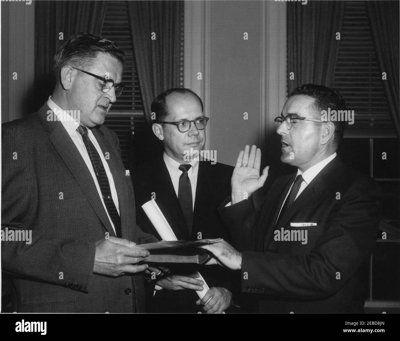 Swearing-in ceremony, Bernard Boutin as Administrator of General Services Administration. Swearing-in ceremony of Bernard L. Boutin as Administrator of the General Services Administration (GSA). (L-R) Herbert L. Miller, Assistant Executive Clerk of the White House; Frederick Dutton, Special Assistant to the President; Bernard Boutin. Ralph Dunganu2019s Office, White House, Washington, D.C. Stock Photo