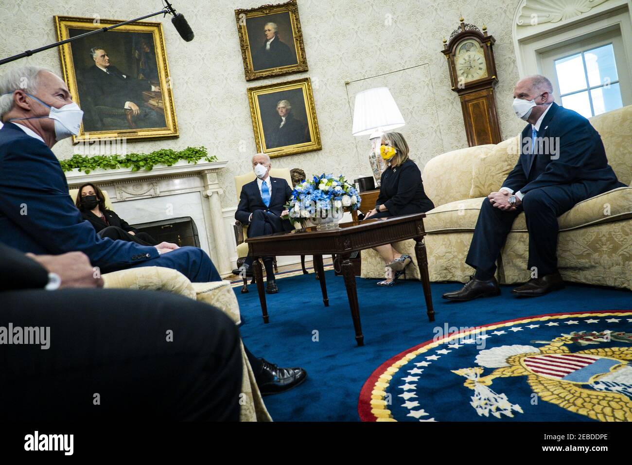 Washington, United States. 12th Feb, 2021. Governor Michelle Lujan Grisham (D-NM).Governor Larry Hogan (R-MD), (R) look on as President Joe Biden meets with governors and mayors to discuss the American Rescue Plan, which will provide aid to fight against COVID-19, in the Oval Office in Washington, DC, on Friday, Feb. 12, 2021. Pool photo by Pete Marovich/UPI Credit: UPI/Alamy Live News Stock Photo