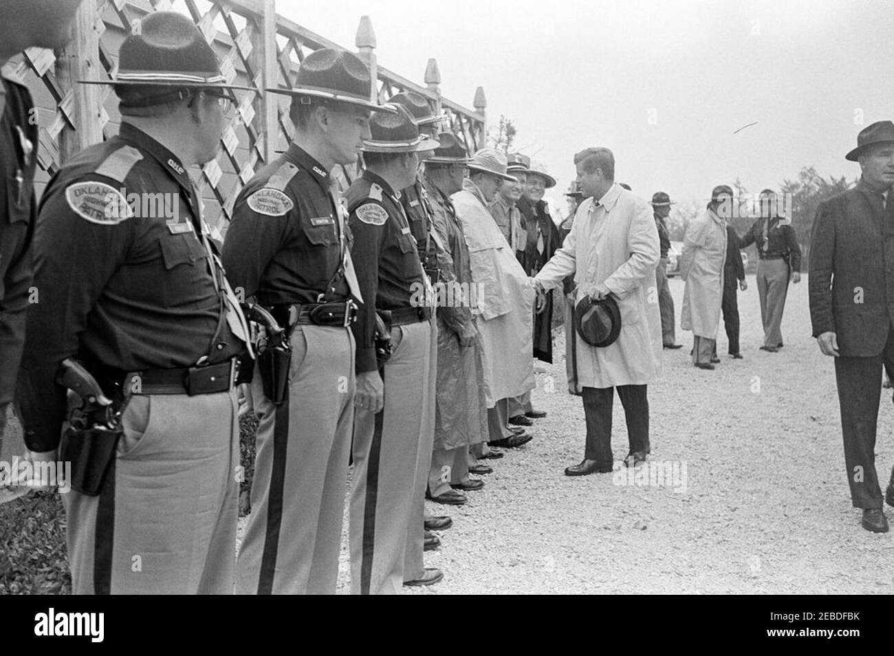 Trip to Oklahoma: President Kennedy with Senator Robert S. Kerr (Oklahoma) at the Kermac Angus Ranch, Poteau, Oklahoma. President John F. Kennedy meets with members of the Oklahoma Highway Patrol. President Kennedy (center, holding hat); others unidentified. Kermac Angus Ranch, Poteau, Oklahoma. Stock Photo