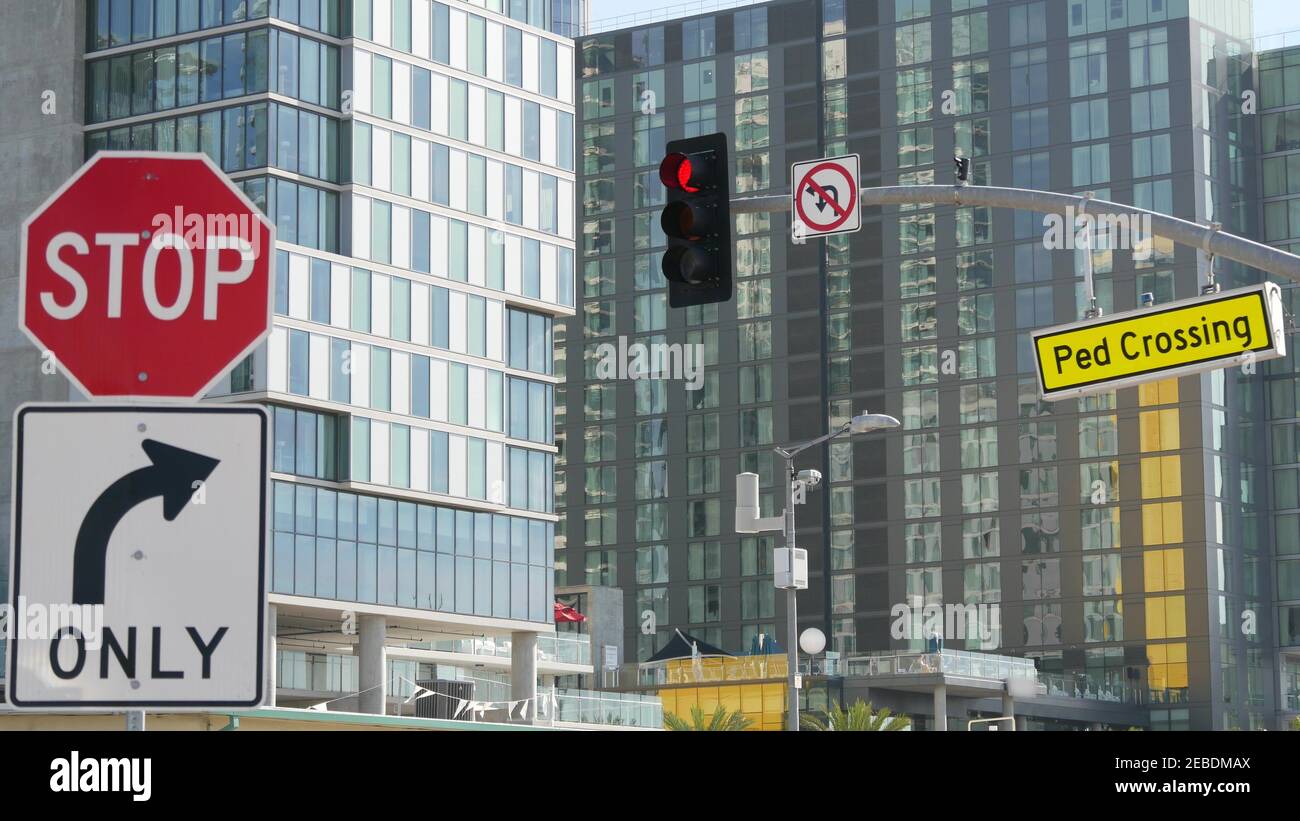 Traffic light and caution sign, road intersection in USA