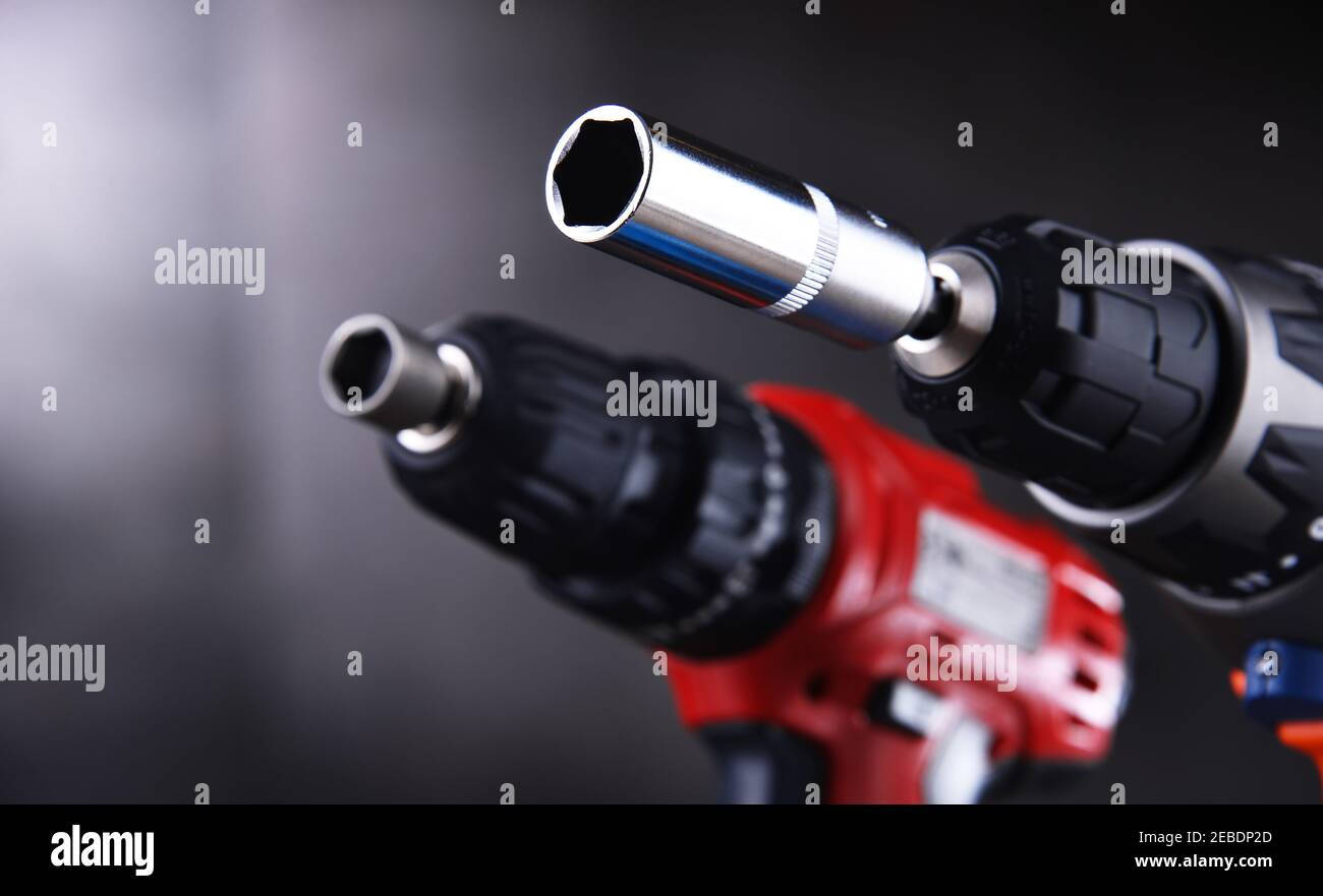 A screw gun and a pistolgrip cordless drill Stock Photo Alamy