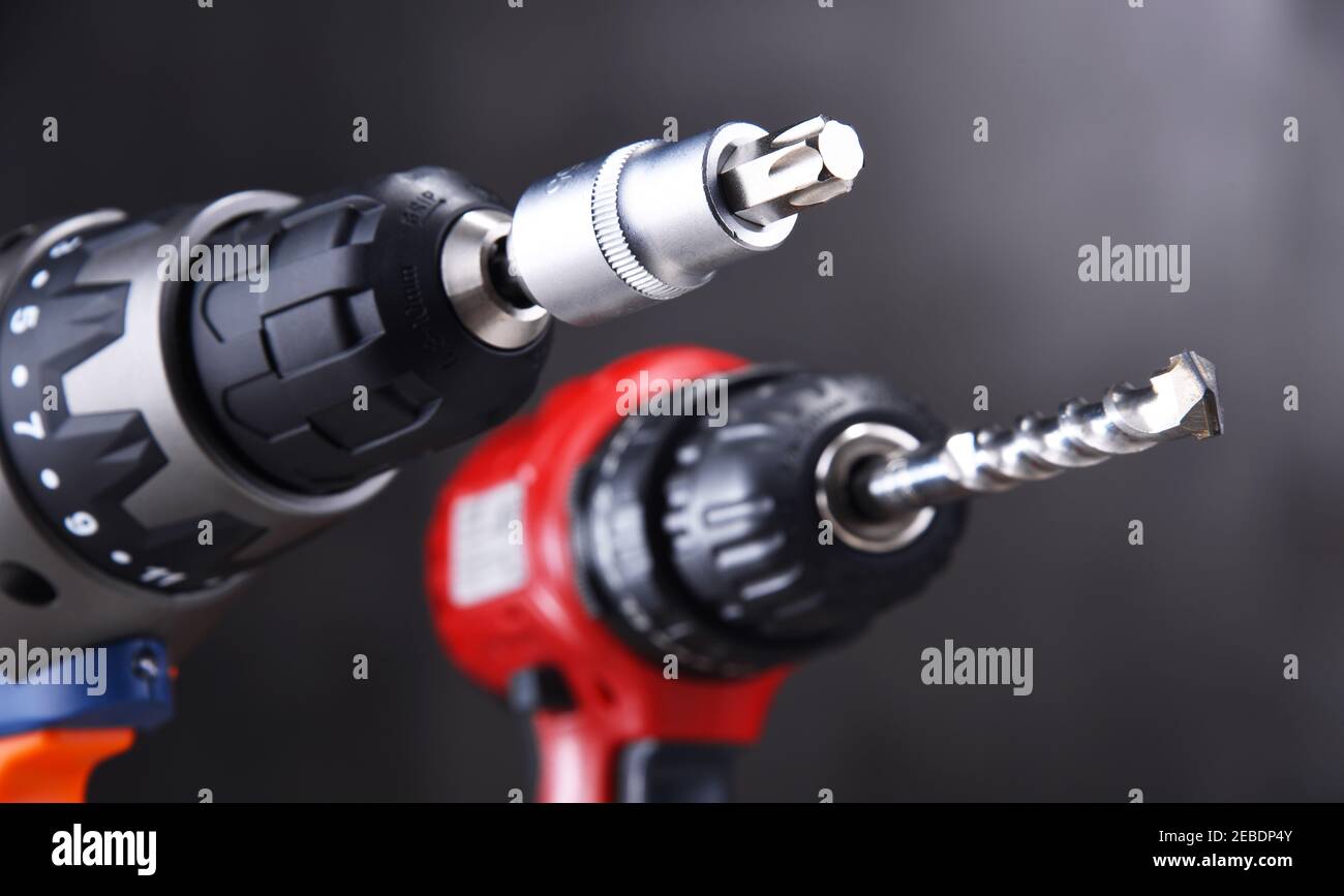 A screw gun and a pistolgrip cordless drill Stock Photo Alamy