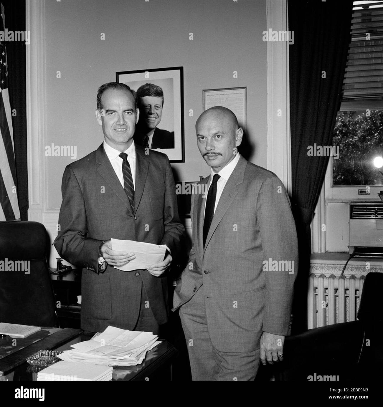 Director of Food for Peace George S. McGovern with Yul Brynner. Director of Food for Peace George McGovern meets with actor Yul Brynner, a member of the American Food for Peace Council, in the Food for Peace Offices, Executive Office Building, Washington, D.C. Stock Photo