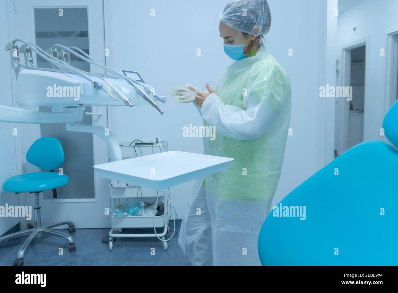 Dentist woman blue scrubs hires stock photography and images Alamy