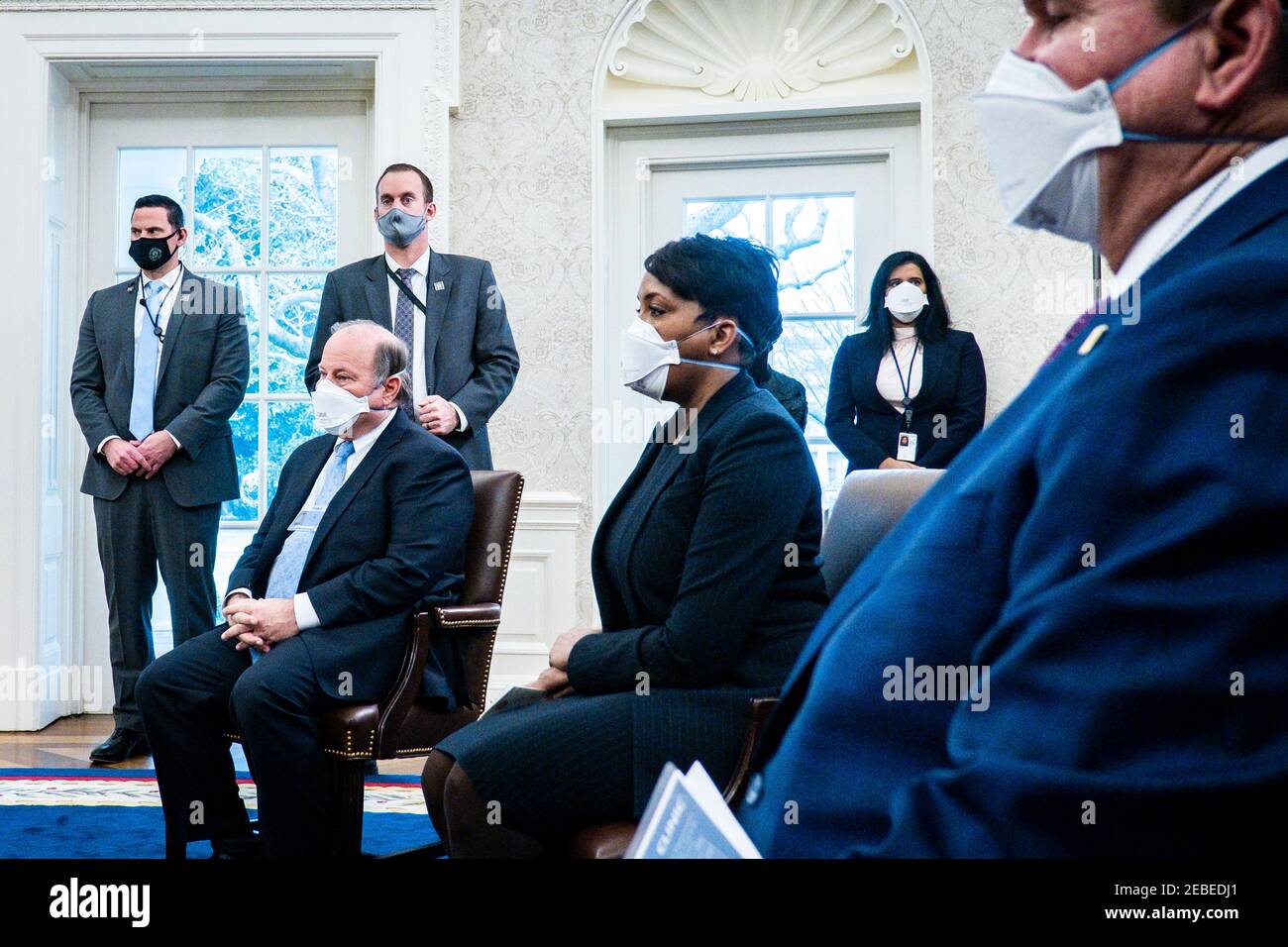Mayor Mike Duggan (D-Detroit, MI), left, and Mayor Keisha Lance Bottoms (D-Atlanta GA), center look on as President Joe Biden and Vice President Kamala Harris meet with governors and mayors in the Oval Office in Washington, DC, on Friday, Feb. 12, 2021, to discuss the vital need to pass the American Rescue Plan, which will get more support to their communities and those on the front lines of the fight against COVID-19. Attending where: Governor Andrew Cuomo (D-NY) Governor Asa Hutchinson (R-AR) Governor Michelle Lujan Grisham (D-NM) Governor Larry Hogan (R-MD) Mayor Keisha Lance Bottoms (D Stock Photo