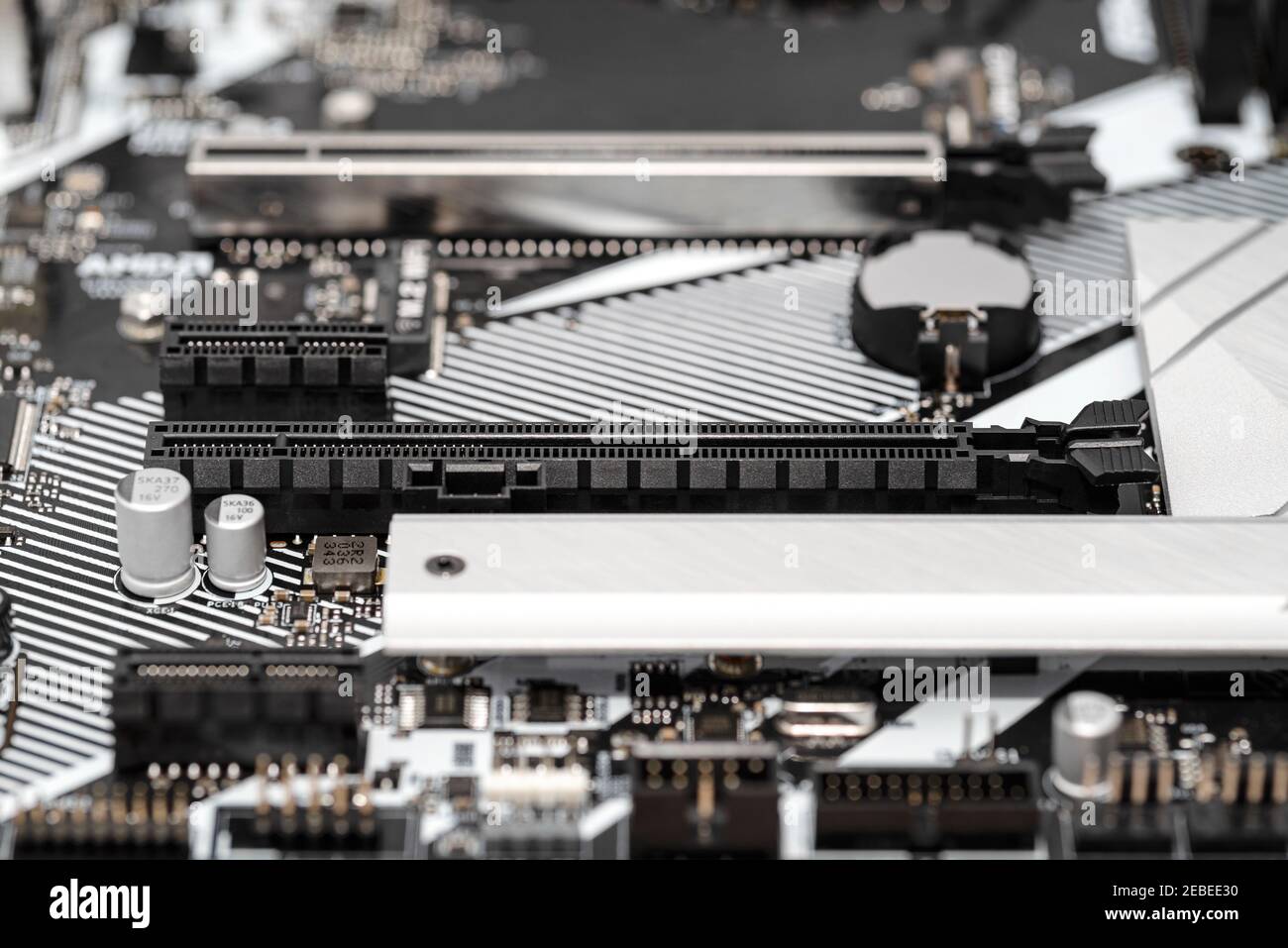 A macro shot of a PCI Express 3.0 x16 and x1 connector on a modern desktop motherboard. Stock Photo