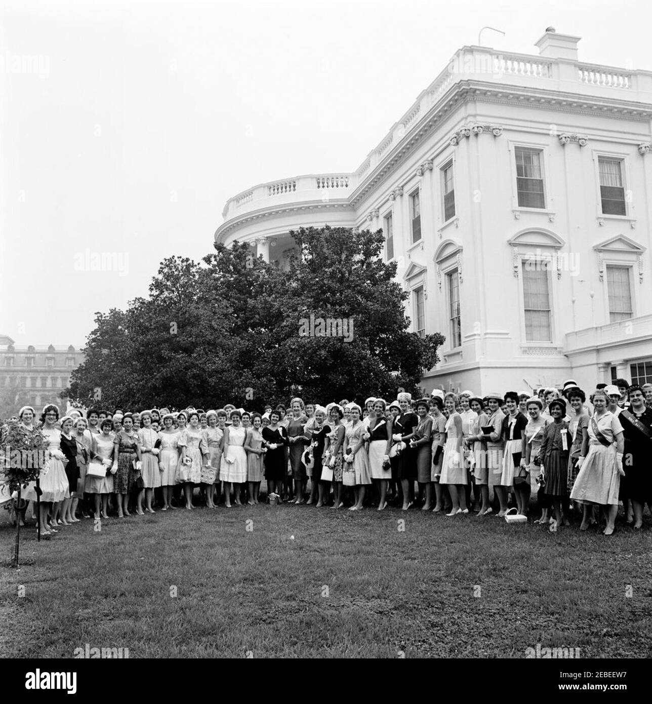 First Ladyu2019s Social Secretary Letitia Baldrige with Girls Nation representatives. Letitia Baldrige, First Lady Jacqueline Kennedyu0027s Social Secretary, stands with state representatives (u201csenatorsu201d) of Girls Nation, the civic training event sponsored by the American Legion Auxiliary. East Garden, White House, Washington, D.C. Stock Photo