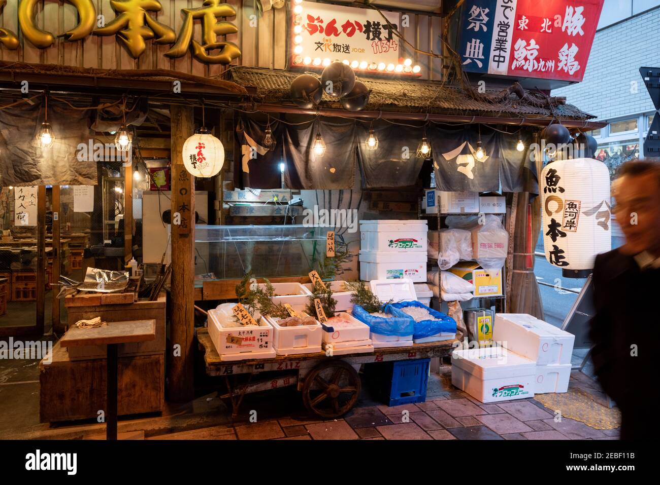 Tokyo, Japan - Jan 21 2016: Yakitori Alley. Night view of the Yakitori Alley underpass under the railway line of the station Yurakucho. Japanese noodl Stock Photo