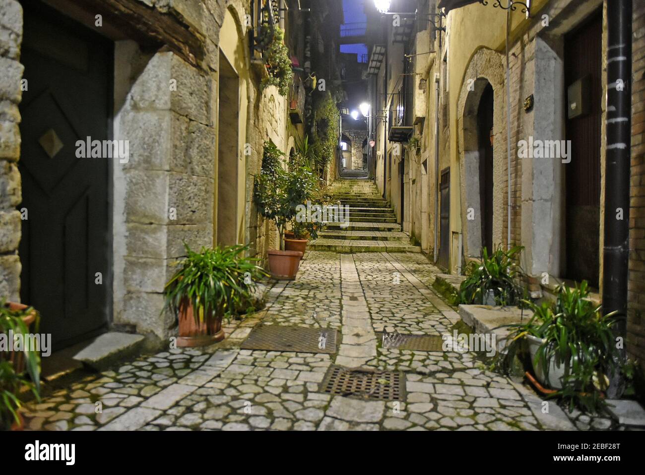 A narrow street between the old houses of Guardia Sanframondi, a