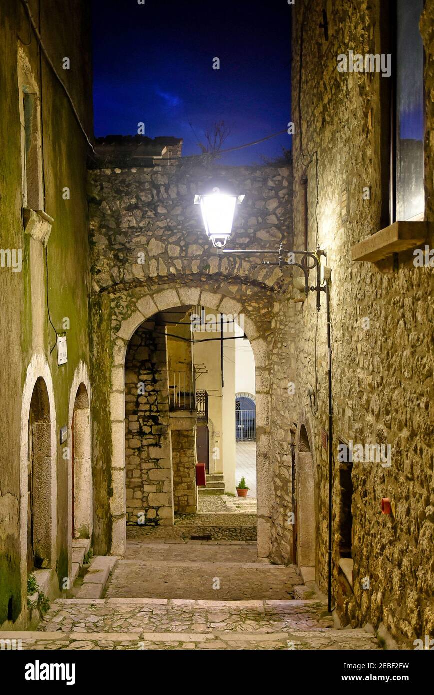 A narrow street between the old houses of Guardia Sanframondi, a medieval village in the province of Benevento, Italy. Stock Photo