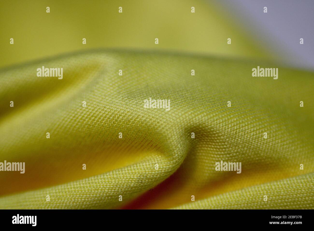 Macro Close up of a Yellow Microfibre Lens Cleaning Cloth Stock Photo