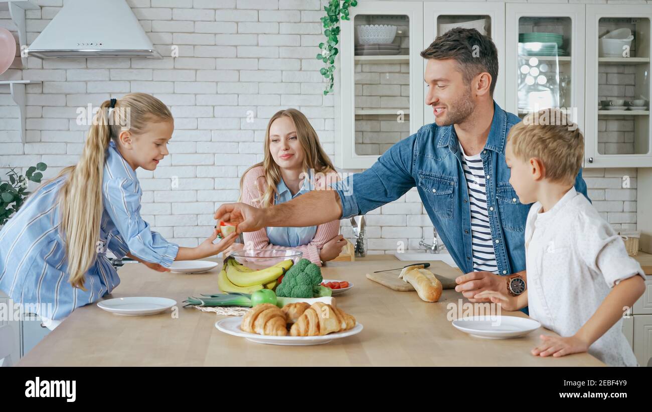 Mother giving food children hi-res stock photography and images - Alamy