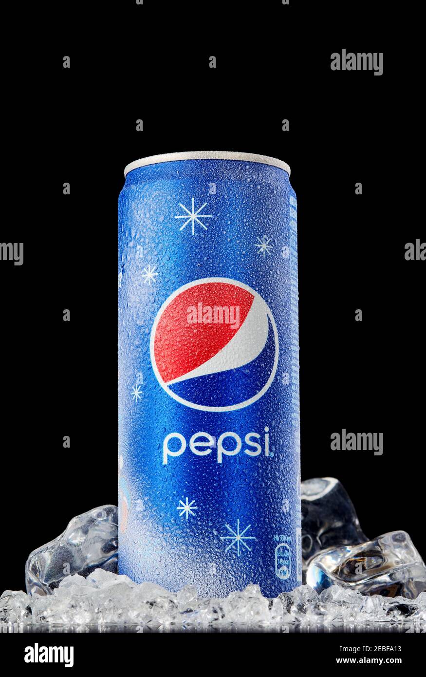 MOGILEV, BELARUS - JANUARY 29 2021: Can of Pepsi cola on ice over black background, Pepsi is a carbonated soft drink produced PepsiCo. Created in 1893 Stock Photo