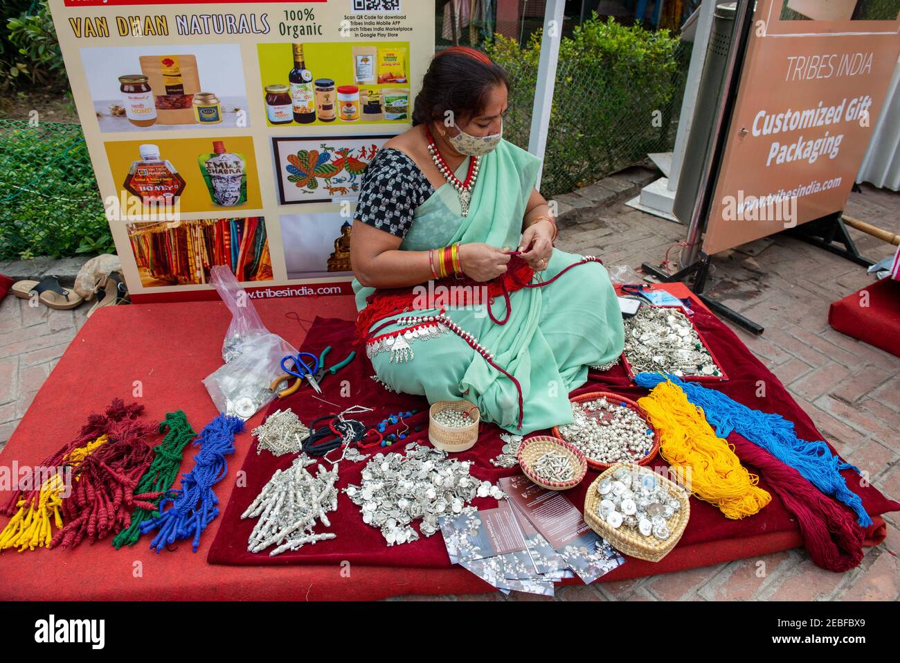 A woman from telangana seen making Banjara jewellery during the annual tribal festival, organised by the Tribal Cooperative Marketing Development Federation (TRIFED), Ministry of Tribal Affairs, is showcasing the rich culture of various tribes of India. Stock Photo