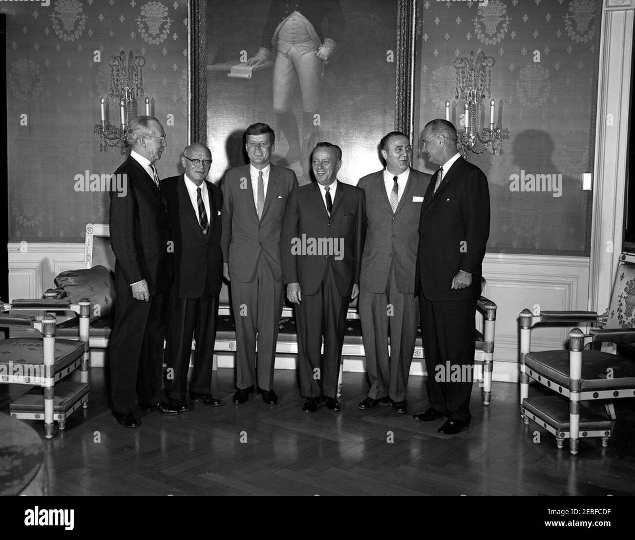 Congressional Coffee Hour (House), 6:00PM. President John F. Kennedy and Vice President Lyndon B. Johnson attend a Congressional Coffee Hour in the Blue Room, White House, Washington, D.C. (L-R): Unidentified; Representative Emanuel Celler of New York; President Kennedy; Representative Lester Holtzman of New York; Representative Alfred E. Santangelo of New York; Vice President Johnson. Stock Photo