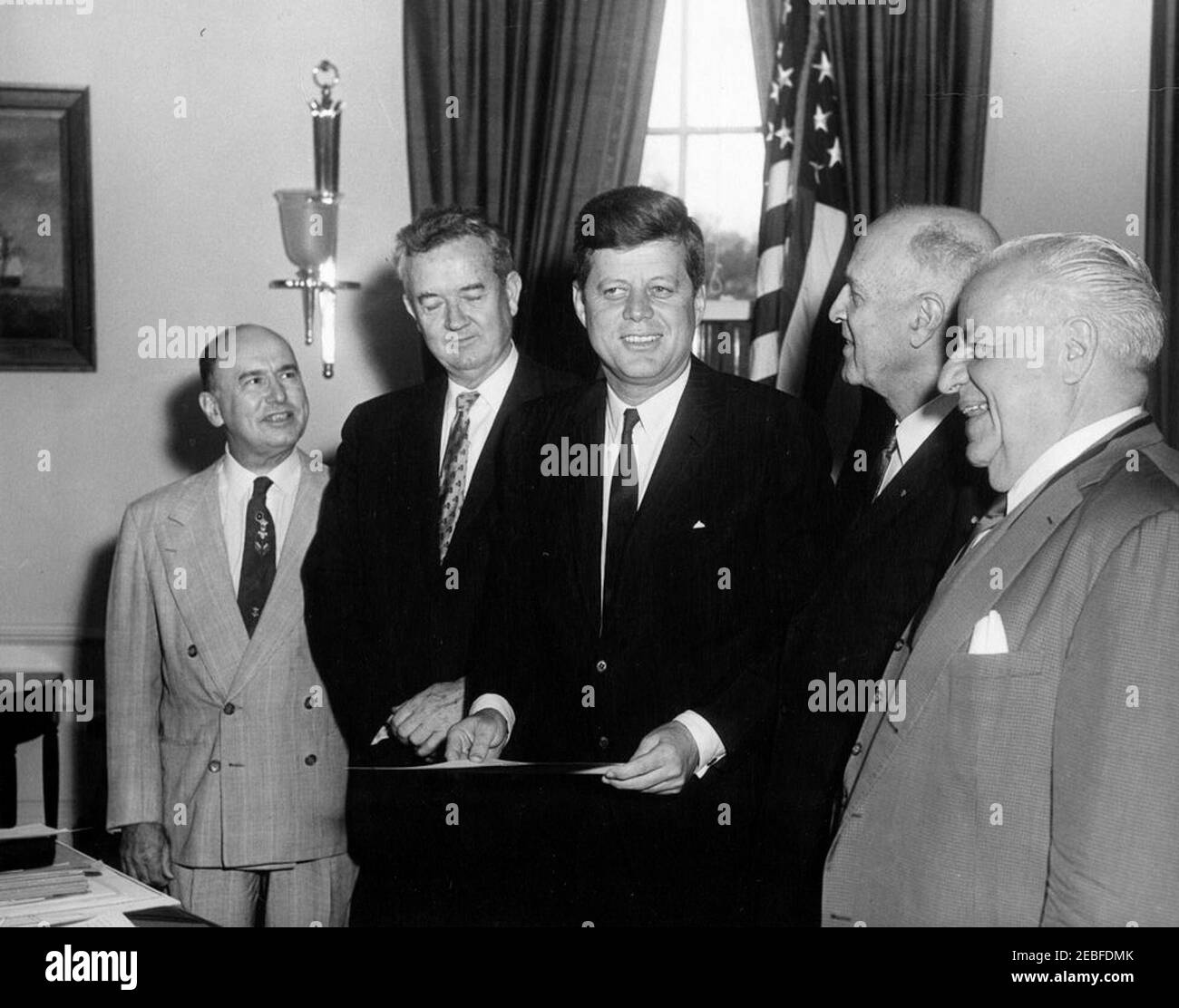 https://c8.alamy.com/comp/2EBFDMK/bill-signing-of-s-900-u2013-medals-commemorating-of-the-250th-anniversary-founding-of-mobile-alabama-352pm-president-john-f-kennedy-poses-for-photographs-after-signing-the-bill-s-900-in-the-oval-office-white-house-washington-dc-the-bill-provides-for-the-striking-of-medals-in-commemoration-of-the-250th-anniversary-of-the-founding-of-mobile-alabama-l-r-alphonse-lucas-assistant-to-representative-frank-boykin-of-alabama-senator-john-sparkman-of-alabama-president-kennedy-senator-lister-hill-of-alabama-representative-boykin-2EBFDMK.jpg