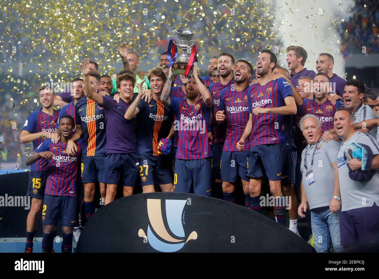 Soccer Football - Spanish Super Cup - Barcelona v Sevilla - Grand Stade de  Tanger, Tangier, Morocco - August 12, 2018 Barcelona's Lionel Messi lifts  the trophy as he celebrates winning the
