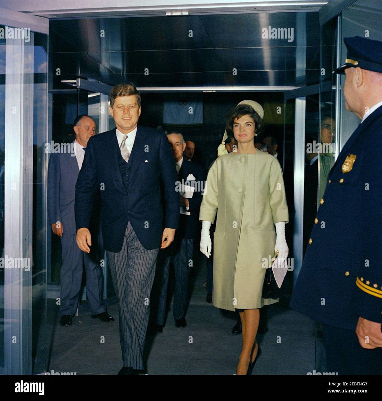 Ceremony celebrating the Unification of Italy, 10:31AM. Ceremony celebrating the Unification of Italy. L-R: Unidentified man; President John F. Kennedy; Head of the Italian Delegation to the United Nations, Gaetano Martino (partially hidden behind President Kennedy); First Lady Jacqueline Kennedy; unidentified police officer. State Department, Washington, D.C.rnrn Stock Photo