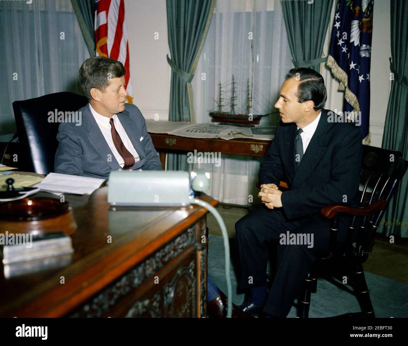Meeting with Aga Khan IV, Prince Karim al-Husseini, 10:15AM. Meeting with The Aga Khan IV. President John F. Kennedy; Aga Khan IV, Prince Karim al-Husseini (The u0100gu0101 Khu0101n, Prince Karu012bm al-Hussaynu012b). Oval Office, White House, Washington, D.C.rnrn Stock Photo