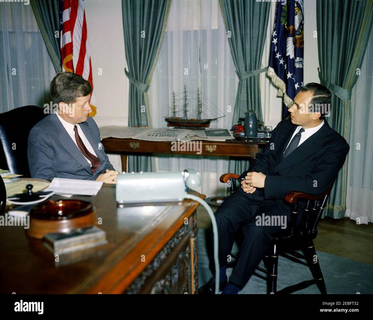 Meeting with Aga Khan IV, Prince Karim al-Husseini, 10:15AM. Meeting with The Aga Khan IV. President John F. Kennedy; Aga Khan IV, Prince Karim al-Husseini (The u0100gu0101 Khu0101n, Prince Karu012bm al-Hussaynu012b). Oval Office, White House, Washington, D.C.rnrn Stock Photo