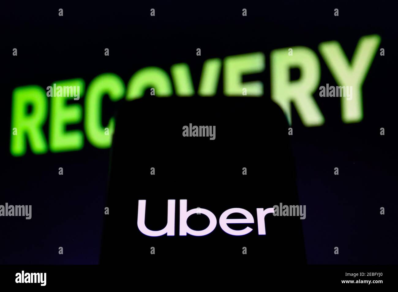 In this photo illustration an Uber company app logo seen displayed on a smartphone. Stock Photo