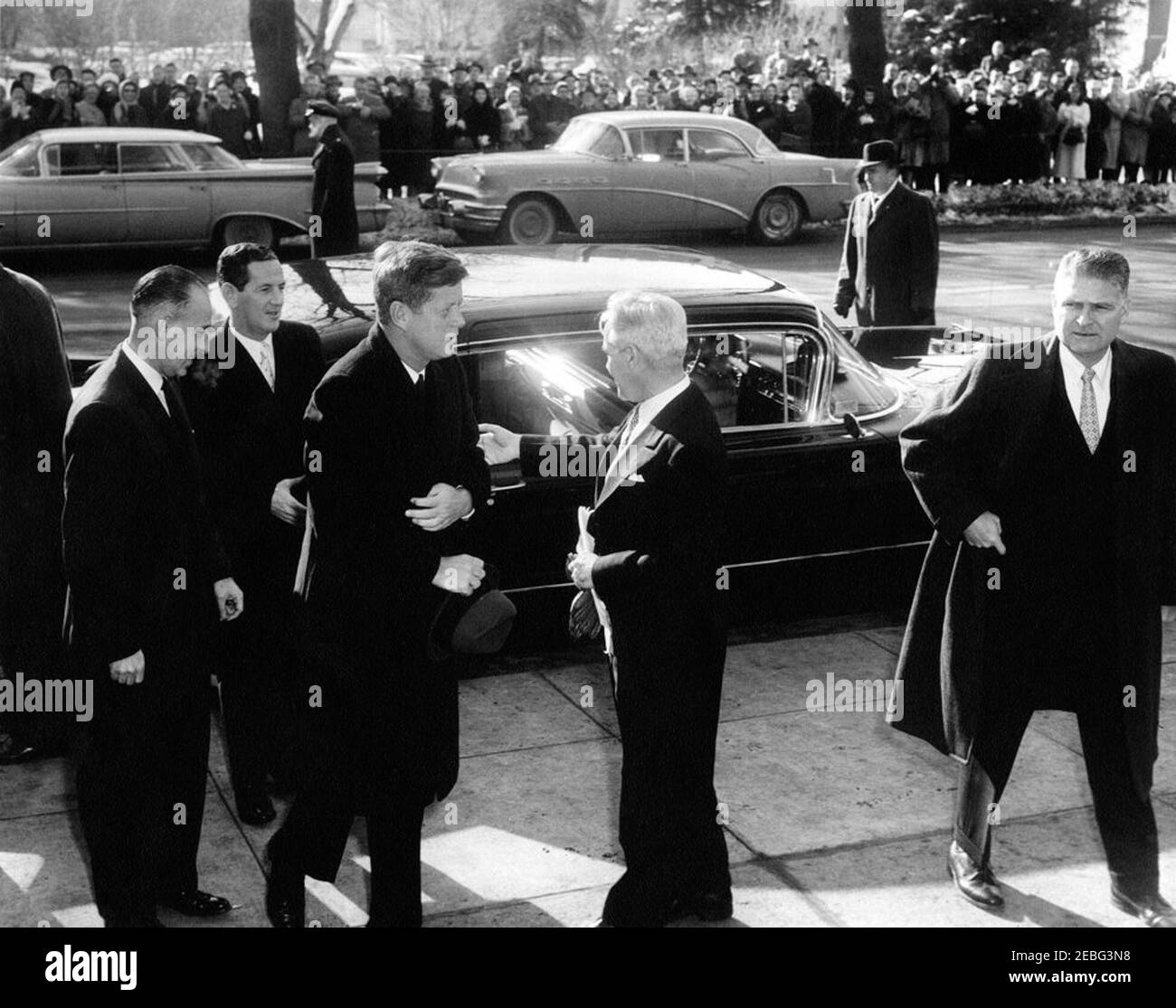 President Kennedy attends Mass, 10:54AM. President John F. Kennedy arrives to attend the annual Red Mass at the Cathedral of Saint Matthew the Apostle. (L-R) Dr. Charles A. Hufnagel; Special Assistant to the President Timothy J. Reardon, Jr.; President Kennedy; two unidentified men; White House Secret Service agent, James J. Rowley. Washington, D.C.rnrn Stock Photo