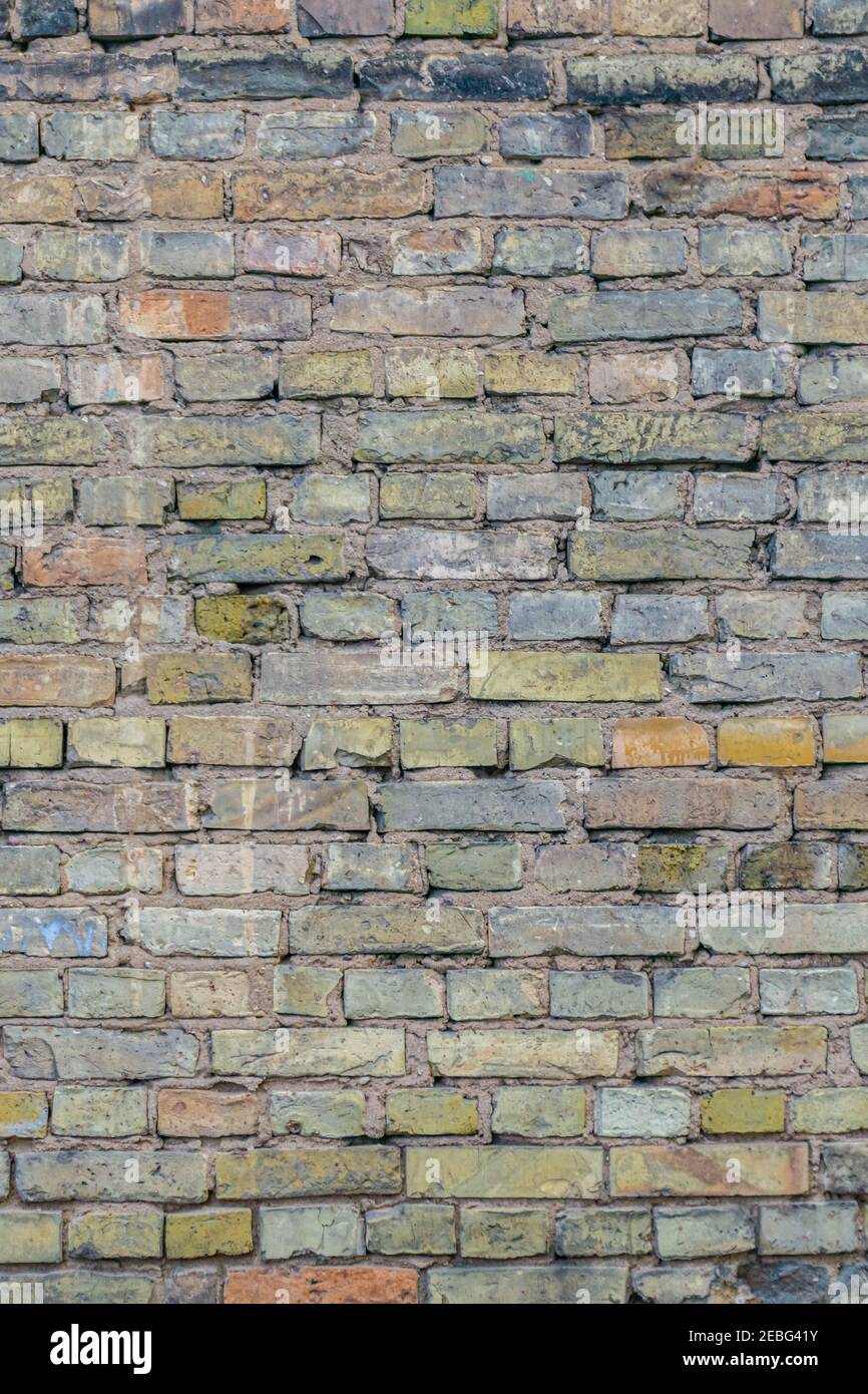 Aged dirty brickwall. Background of old brick wall. Pastel colors wall