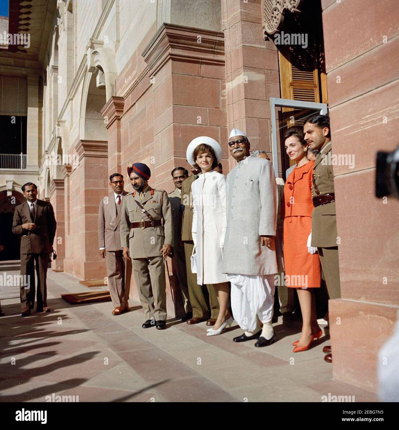 First Lady Jacqueline Kennedyu2019s (JBK) trip to India and Pakistan: New Delhi, Delhi, India, visit to Rashtrapati Bhavan, Official Residence of the President of India Dr. Rajendra Prasad. First Lady Jacqueline Kennedy and President of India Dr. Rajendra Prasad (right) stand in the doorway of Rashtrapati Bhavan, the Presidentu2019s official residence. Mrs. Kennedyu2019s sister, Princess Lee Radziwill of Poland, stands at right. New Delhi, India. Stock Photo